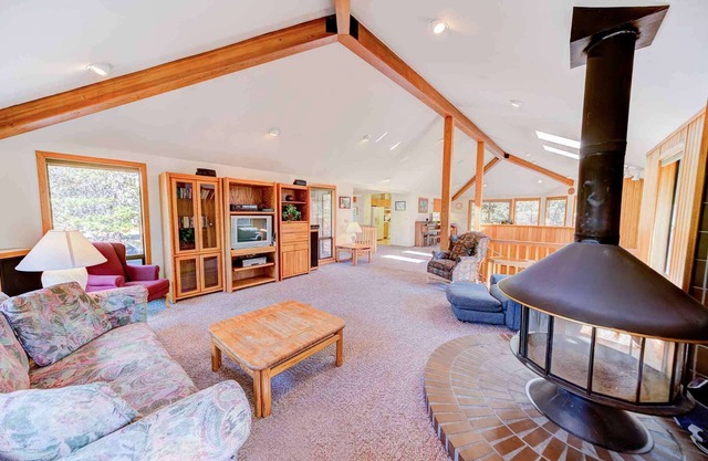 Spacious, unique reverse-living home w/ private deck+hot tub. FREE pool/water pa