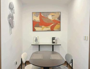 One-Bedroom Apartment with Balcony and City View